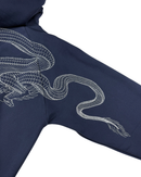 Close-up of a navy blue hoodie sleeve featuring a detailed white embroidered dragon design, shown against a plain white background.