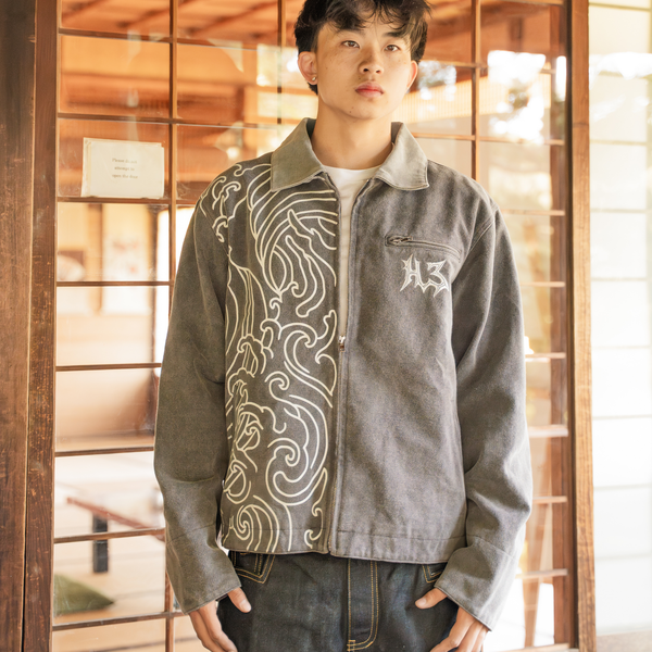 Umi Work Jacket in a doorway wearing Hidden Elements