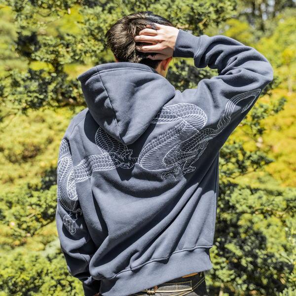 Soaring Hoodie (Ocean), worn from the back wearing Hidden Elements